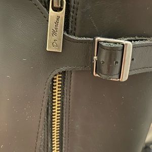 Dr. Martens black leather boots.
